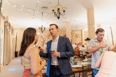 Guests visiting in Alamo Hall before being seated for dinner