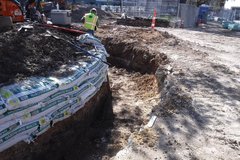 Hollowed out circular dirt area in excavation plot