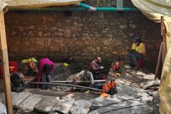 Group of archaeologists working outside of the Long Barrack
