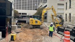 Construction truck and workers in outdoor area