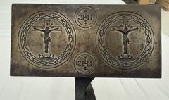 Iron press with etched design of Jesus on the cross on either side