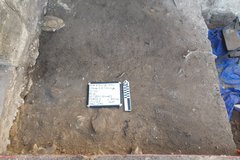 Flat stone surface in an excavation unit