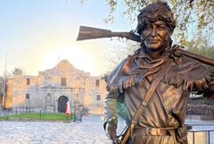 Statue of David Crockett in front of Alamo Church