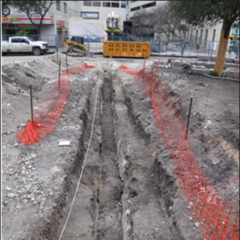 Orange netting around excavation plot