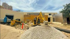Construction truck outside of education center building