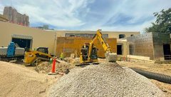 Construction truck outside of education center building