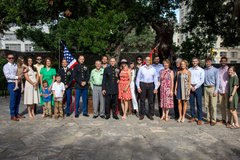 Marine General standing with friends and family after his ceremony