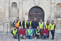 Archaeology team outside front door of Alamo Church