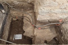 Inside of an excavation unit with exposed natural caliche layer
