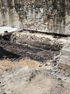 Dark clay beneath the concrete setting bed