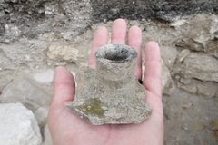 Candle holder in the palm of a hand