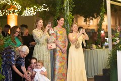 Ladies watching the dance floor, taking photos of the couple during their first dance