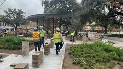 Construction workers setting out pavers in Plaza de Valero walkway
