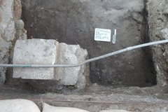 Inside an excavation unit with a step area in the bottom corner