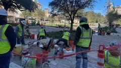 Group of construction workers setting the flooring at Plaza de Valero