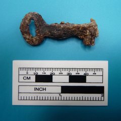 Skeleton key next to a ruler to show size