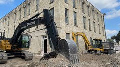 Construction truck outside of museum building