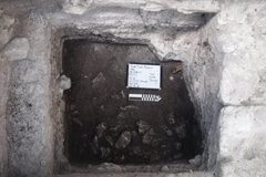 Bedrock exposed at the bottom of an excavation unit