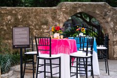 Cocktail tables with colorful accents and flowers