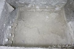 Bottom of excavation unit with a triangular piece near the left top corner