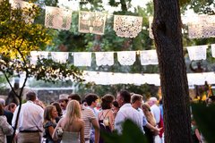 Standing guests enjoying the event at Cavalry Courtyard