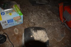 Wall loss is collected at the Alamo in clear, named plastic bags.