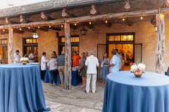 Guests lined up at a dinner buffet in Alamo Hall Patio