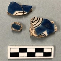 Several Puebla Polychrome sherds with blue, white, and black colors