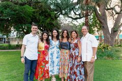 Guests posing and smiling in Alamo Gardens