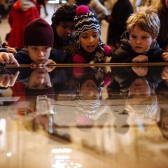 Children looking at an Alamo exhibit