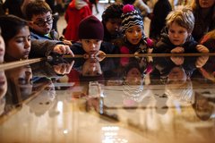 Children looking at an Alamo exhibit