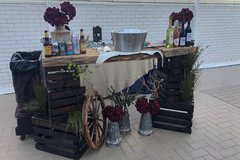 Bar with beer, wine, and flowers