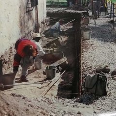 Excavations along the exterior of the south transept wall of Church.