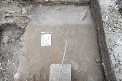 Inside an excavation unit about 60 cm below the surface