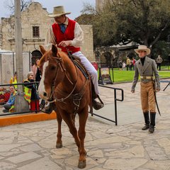 Living historian on horseback in front of Alamo Church