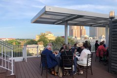 People sitting at a table on the terrace