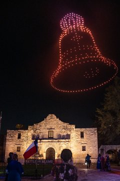 Church bell in drone lights over Alamo Church at night