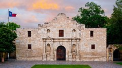 Alamo Church with green grass in front in daylight