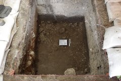 Dirt bottom inside an excavation unit