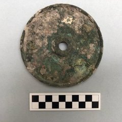 Circular artifact thought to be a candlestick holder