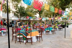 Tables set with colorful runners and centerpieces in Cavalry Courtyard