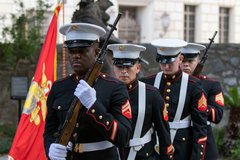Marines departing their procession after presenting the American and Marines flag