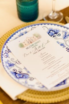 Close up of plate with a menu on it that includes an image of Alamo Church