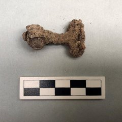 Ferrous can key artifact