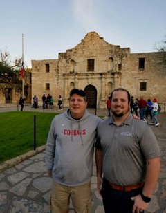 WSU Coach Mike Leach (left) and Alamo staff member Kolby Lanham (right) in front of Alamo Church