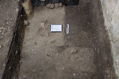 Cobble surface at the bottom of an excavation unit