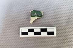 Ceramic fragment with some green decorative color