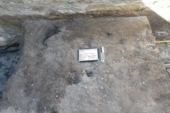 Loose soil on top of the level of an excavation unit