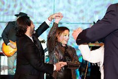 Couple dancing in front of the stage at an event