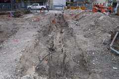 Dirt in excavation area next to Alamo Street